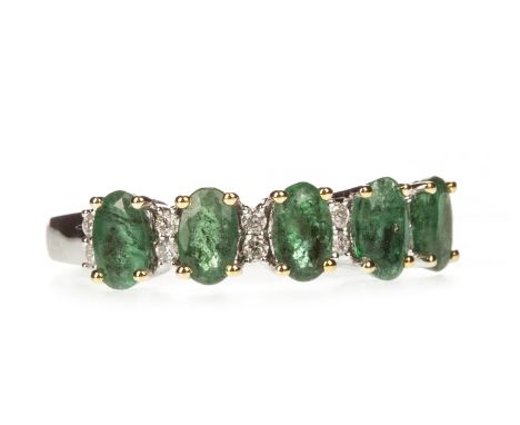 EMERALD AND DIAMOND RING, the five oval emeralds interspaced by pairs of round brilliant cut diamonds, the diamonds totalling