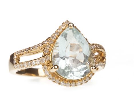 AQUAMARINE AND DIAMOND RING, the pear shaped aquamarine 12x9mm, within a halo of round brilliant cut diamonds, on bifurcated 