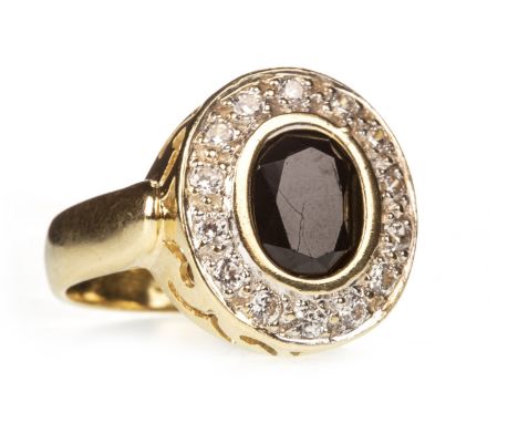 BLACK AND WHITE GEM SET RING, the oval black gem within a halo of round white gems, marked 750, size N, 7.4g