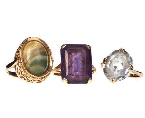 THREE GEM SET RINGS, including a purple gem set example and blue gem set example, size M 1/2 and L respectively, each in nine