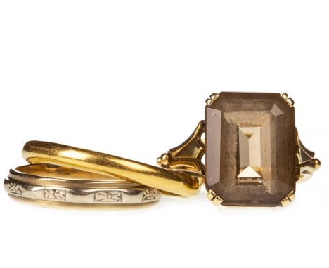 SMOKY QUARTZ RING, set with an emerald cut smoky quartz 13.6mm long, on bifurcated shoulders, marked 750, size J, 5.3g; along