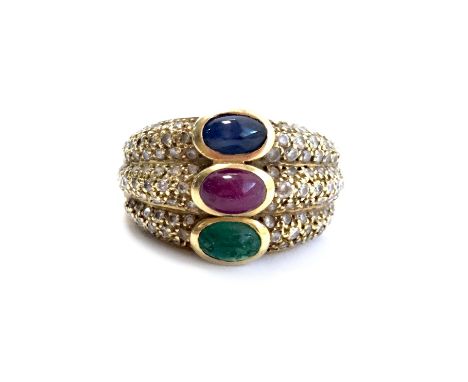 GEM SET AND DIAMOND DRESS RING, set with a cabochon red, green and blue stone flanked by round brilliant cut diamonds on eith