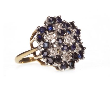 BLUE GEM AND DIAMOND CLUSTER RING, the bezel 20.5mm wide and formed by floral clusters set with round faceted blue gems and d