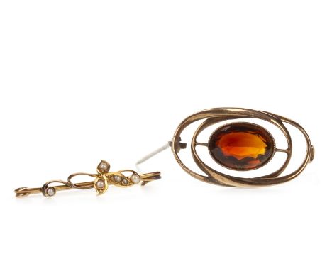 TWO EARLY TWENTIETH CENTURY BROOCHES, one Edwardian and set with a seed pearl foliate motif, 33mm long, unmarked, 1.5g, the o