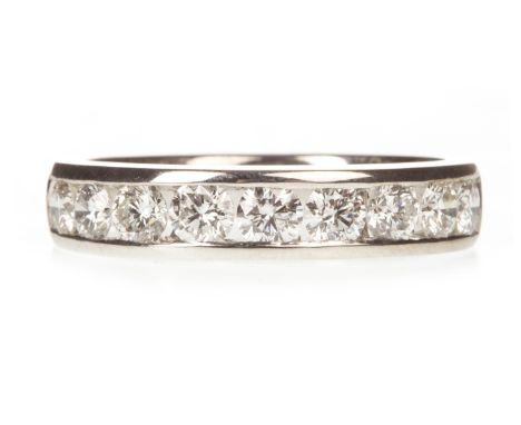 DIAMOND HALF ETERNITY RING, the channel set round brilliant cut diamonds totalling approximately 0.72 carats, marked 750, siz