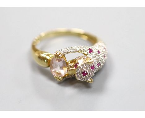   A modern Cartier style 585 yellow metal, pink topaz?, ruby and diamond encrusted leopard ring,size R/S, gross 5.2 grams.