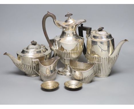   A George V demi fluted silver four piece tea and coffee service, Mappin &amp; Webb, Sheffield, 1912, a matched plated hot w