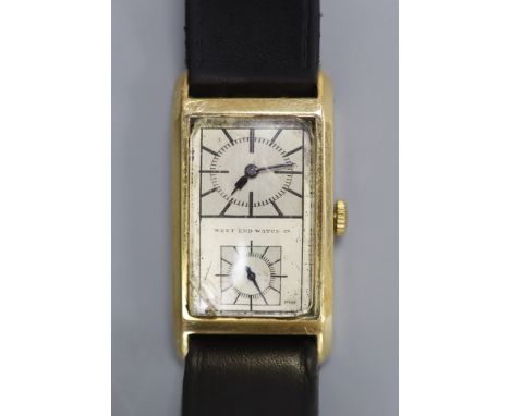   A gentleman's 1940's/1950's 18k West End Watch Co. manual wind rectangular split dial wrist watch, on associated leather st