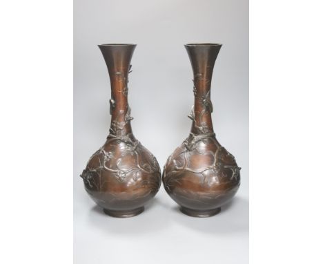   A pair of Japanese Meiji period bronze bottle vases, repaired to neck, height 46cm