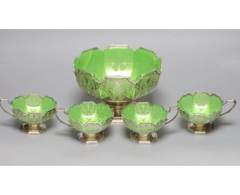   A George VI silver and green glass dessert set by Mappin &amp; Webb (a.f.),comprising a large bowl and four smaller single 