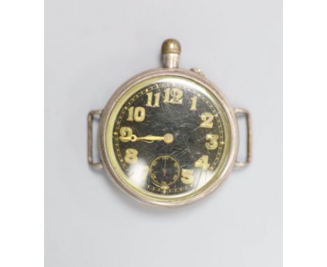   An early 20th century white metal Borgel? cased manual wind strapless wrist watch, with black dial.