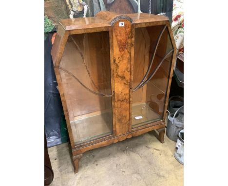   An Art Deco burr walnut display cabinet, width 90cm depth 36cm height 124cm