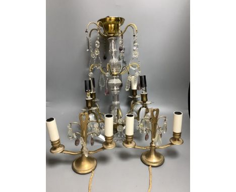   A French boudoir four-light chandelier with clear and amethyst glass pendant drops and a similar pair of French two-light b