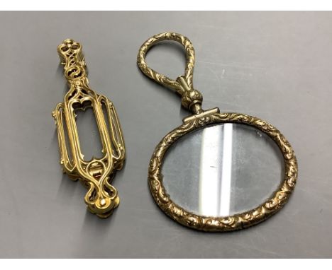   A late 19th century French yellow metal (18ct poincon mark) lorgnette and a yellow metal overlaid eye glass.lorgnette gross