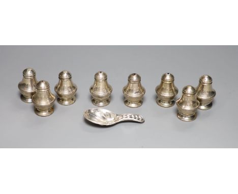   A set of eight modern silver condiments, 48mm, 89 grams and a silver plated caddy spoon.