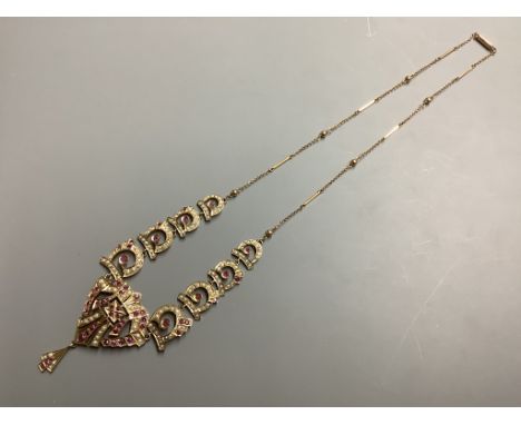   A yellow metal ruby and seed pearl set drop necklace, length 52 cm, gross weight 17.6 g.
