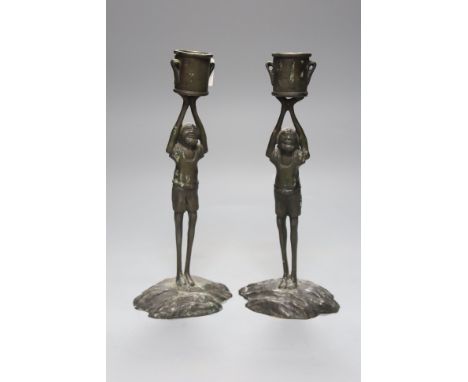   A pair of bronze figural candlesticks, height 24cm
