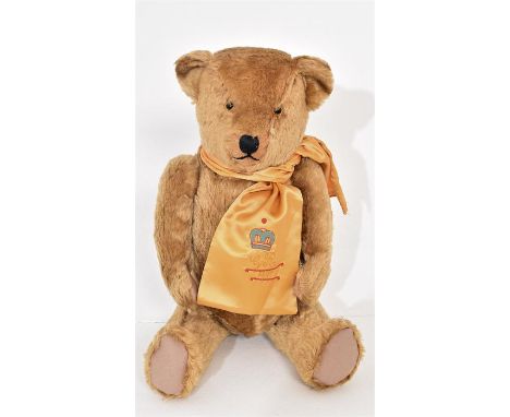 A vintage limited edition Mohair Bear, in all round good condition. With golden scarf; embroidered with a crown, 'G R. 1931.'