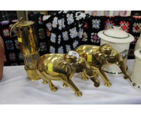 Two brass elephant ornaments and a decorative miners lamp