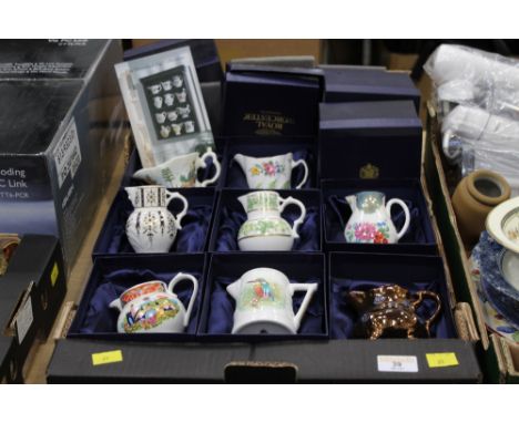 Seven Royal Worcester 250th Anniversary jugs, and a lustre jug