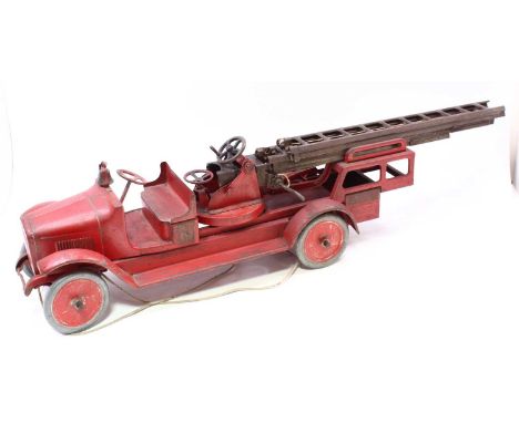 A large scale cast iron and pressed steel model of a Buddy L fire engine finished in red with CRD transfers to side, and Budd