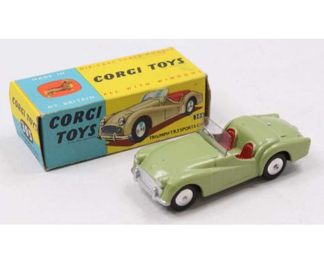 A Corgi Toys No. 305 Triumph TR3 Sports Car, green body with red interior and silver hubs, housed in the original blue &amp; 
