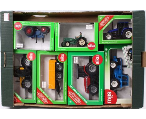 A Siku 1/32 scale boxed group of seven farm-related models to include No. 3465 MAN 4R3, No. 2652 Tractor New Holland 5635, No