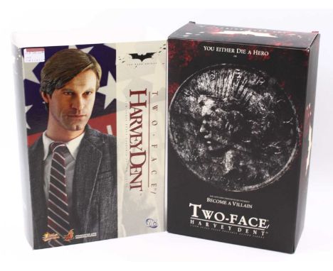A Hot Toys Ltd 1/6 scale action figure of a Harvey Dent/Two face 'The Dark Knight', appears complete, housed in the original 