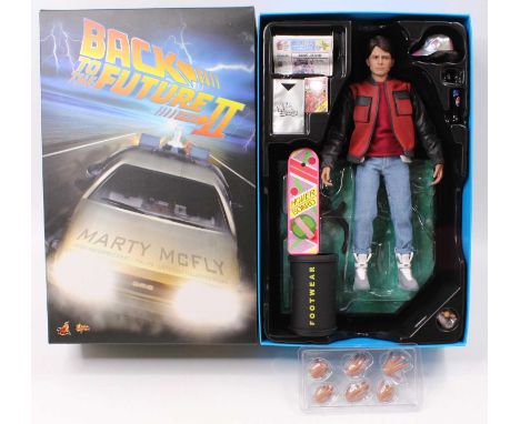A Hot Toys Ltd 1/6 scale action figure of Marty McFly No. MMS 379 'Back to the Future 2', appears incomplete and displayed, h