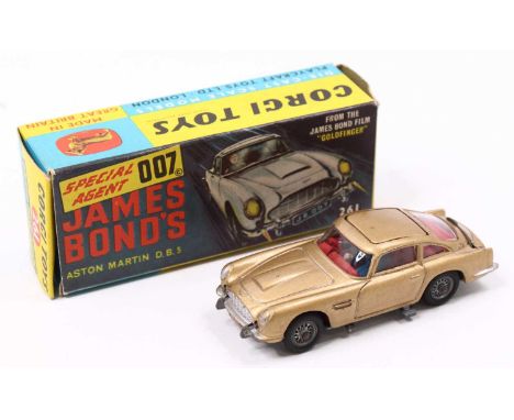 Corgi Toys No. 261 James Bond's Aston Martin DB5, metallic gold body, with wire wheels, all mechanisms in working order, the 