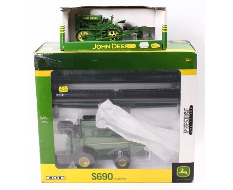 An ERTL 1/32 scale model of a No. 453410 Prestige Collection John Deere S690 combine harvester, housed in the original window