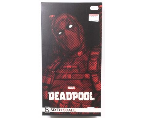 A Sideshow Collectables 1/6 scale action figure of Deadpool 'Marvel', appears incomplete, housed in the original card and foa