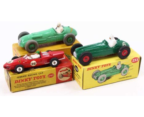A Dinky Toys group of three to include Dinky 233 Cooper Bristol Racing Car in green with red hubs and racing number 6, a Dink