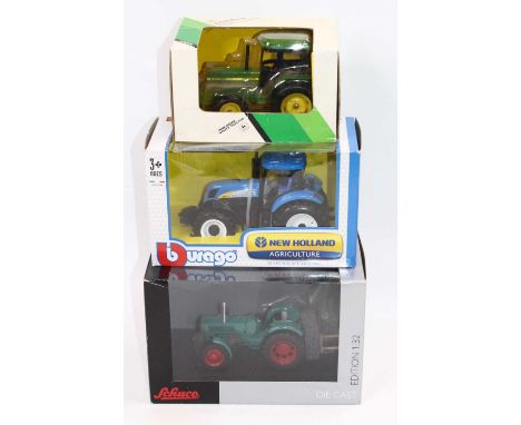 Three farm related 1/32 scale models to include Burago New Holland T7040 tractor, ERTL 5512 John Deere utility tractor, toget
