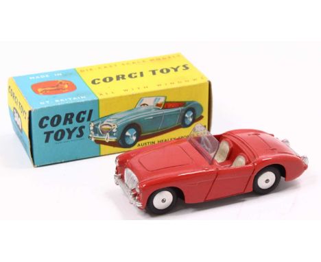 Corgi Toys, 300 Austin Healey sports car, red body with cream seats, flat spun hubs, in the original blue and yellow all-card