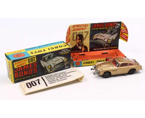 Corgi Toys No. 261 James Bond's Aston Martin DB5, metallic gold body, with wire wheels, the model has some play wear, comes w