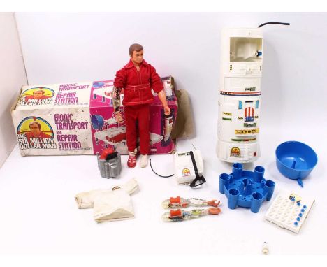 A boxed The Six Million Dollar Man bionic transport and repair station together with dollar man figure, two spare arms, kenne