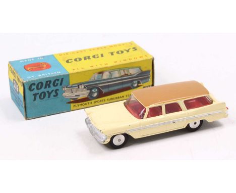 Corgi Toys No. 219 Plymouth Sports Suburban station wagon comprising of cream body with brown roof, light tan base, and red i