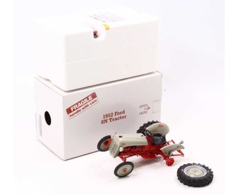 A Danbury Mint 1/16 scale Ford 8N tractor 1952 (in need of repair) housed in the original card box