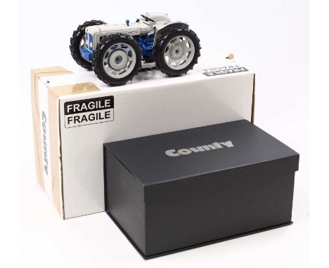 A Universal Hobbies 1/16 scale UH2781 Grey County Super Four tractor, housed in a foam-packed card box