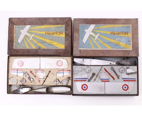Two Mecavion Baby Aeroplane construction sets, both in silver fuselages with matching wings and roundels to the wings, with r