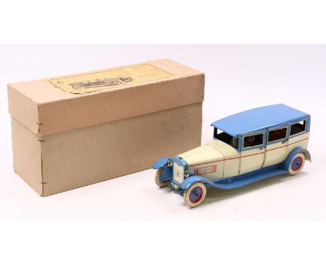 A reproduction Lehmann style Baron 504 tinplate limousine by DBS finished in cream light blue and red housed in the original 
