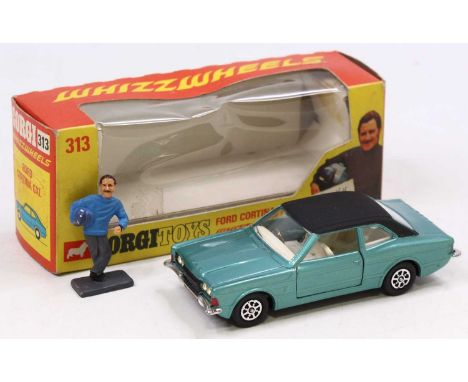 Corgi Toys No. 313, Ford Cortina in light blue complete with Graham Hill figure in near mint condition, comes in the original