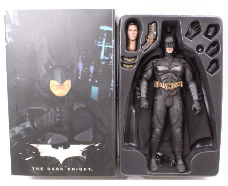 A Hot Toys Ltd 1/6 scale action figure of Batman No. MMS71 'The Dark Knight', parts missing, has been displayed, housed in th