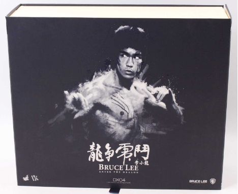 A Hot Toys Ltd 1/6 scale figure of Bruce Lee No. DX04 'Enter The Dragon' (appears complete), housed in the original card and 