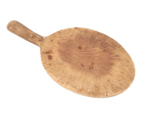 Mouseman: A Robert Thompson of Kilburn English Oak Cheese Board, with carved mouse signature on handle, 38cm  Provenance: Fro