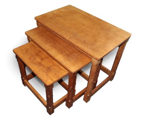 Mouseman: A Robert Thompson of Kilburn English Oak Nest of Tables, each with carved mouse signature, largest 61cm by 38cm, 47