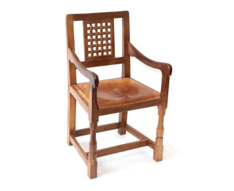 Mouseman: A Robert Thompson of Kilburn English Oak Lattice Back Armchair, with tan hide seat, with carved mouse signature, 90