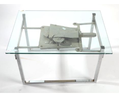 An Industrial Form Chromed Metal Square Tubular Form Coffee Table, with plate glass top, the legs joined by a shelf in the fo