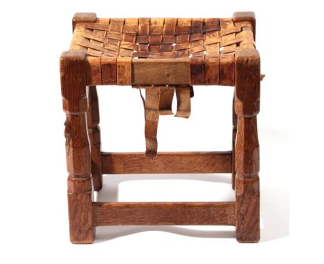 Mouseman: A Robert Thompson of Kilburn English Oak Stool, strap leather top, on four octagonal legs joined by stretchers, wit